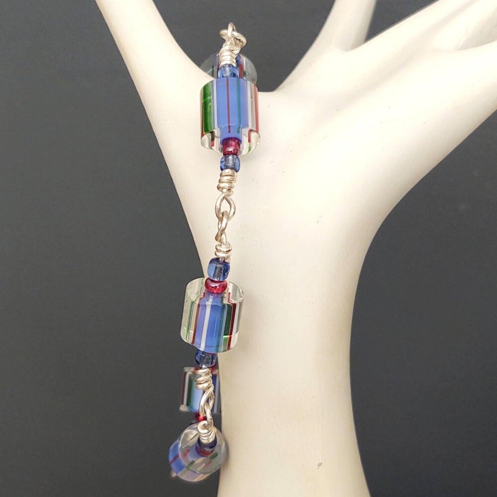 Clear glass bracelet with red, blue and green accents-toggle closure